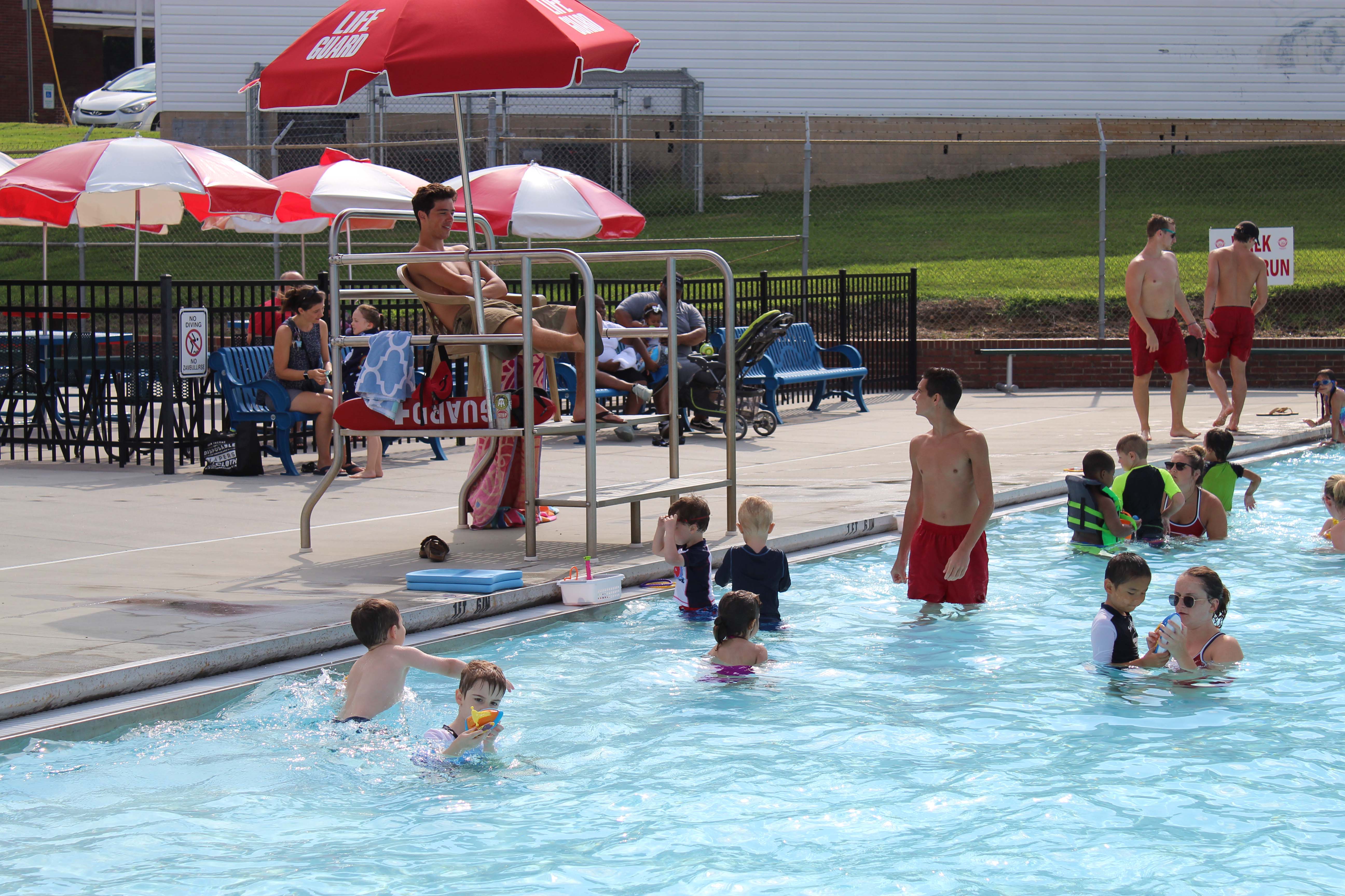Picture of Pool with Swimmers and Lifeguard